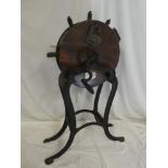 A Victorian oak and steel mounted circular knife cleaner by Kent of London on wrought iron stand