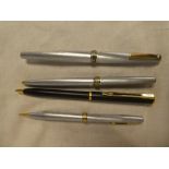 A Sheaffer pen and pencil set in original case and a propelling pencil