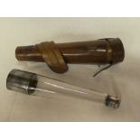 A good quality old glass tapered hunting flask with silver plated mounts,