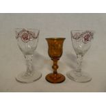 A pair of 19th Century glass goblets with painted portrait and swag decoration,