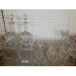 A pair of good quality cut glass baluster-shaped decanters and stoppers with star cut decoration;