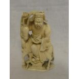 A 19th Century Japanese carved ivory okimono figure of a male trader seated on a donkey,