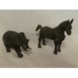 An Eastern bronze figure of a horse 6½" long and one other similar figure of an elephant (2)