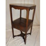 A George III mahogany square two-tier night stand with a single drawer in the frieze on