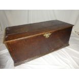 A George III oak rectangular trunk with two internal drawers and candle box enclosed by a hinged
