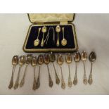 A set of twelve silver Edward VII coffee spoons with decorated handles,