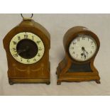 An Edwardian mantel clock with ceramic circular dial in inlaid mahogany arched case and one other