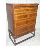 A Queen Anne-style walnut and crossbanded chest of four graduated drawers below a brushing slide on