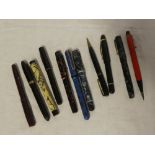A selection of various vintage fountain pens and pencils including WHS, Waterman's, Mabie Todd,