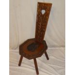 A good quality carved oak spinning chair with decorated tapered back,