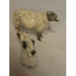 A Studio pottery figure of a sheep by K Rudge 9½" long together with a similar head study of a hare
