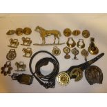 A selection of 19th Century and later horse brasses and bosses together with leather strap,
