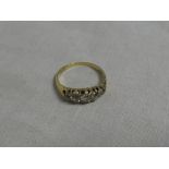 An 18ct gold engagement ring set five graduated diamonds