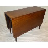 A 19th Century mahogany rectangular drop leaf dining table on square-shaped legs