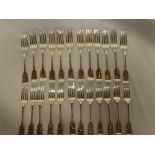 A set of twelve Victorian silver fiddle pattern table forks,