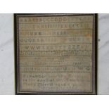 A mid 19th Century square needlework sampler depicting alphabet,