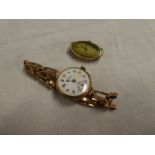 A 9ct gold ladies wristwatch by Perry of Birmingham with elasticated strap and one other 9ct gold