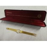 A ladies 18ct gold wristwatch by Longines with 18ct gold strap,