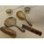 A George V silver six piece dressing set comprising hand mirror, clothes brush, hairbrush,