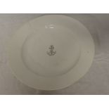 A white glazed circular bowl with central anchor "A" emblem,