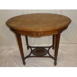 A 19th Century Continental mahogany oval centre table with decorated frieze on square tapered legs