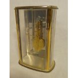 A good quality mantel clock by Jaeger-le Coultre with visible movement and escapement in gilt brass