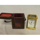 A good quality carriage clock with enamelled rectangular dial in brass traditional case and Morocco