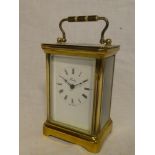 A good quality carriage clock by Henley in brass traditional case