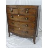 An early to mid-19th Century mahogany bow front chest of two short and three long drawers with