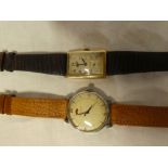 A gentleman's 9ct gold wristwatch by Tissot with rectangular dial and leather strap and a