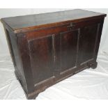 An early 19th Century oak rectangular coffer with triple panelled front and internal candle box