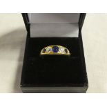 A good quality 18ct gold heavy dress ring set three sapphires and two diamonds