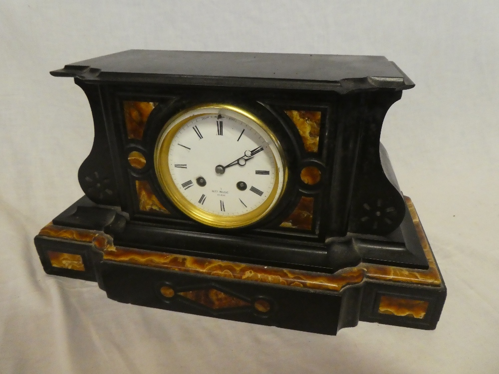A late 19th Century French mantel clock by Henry Marc of Paris with enamelled circular dial in