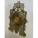 A good quality mantel clock with gilt circular dial in brass relief decorated pierced case 12½"