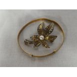 A 9ct gold dress brooch in the form of a flower with pearl centre and a slim 9ct gold adjustable