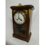 A good quality French mantel clock with circular enamelled dial in brass mounted walnut & maple