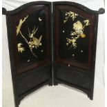 A small Japanese lacquered two-fold arched screen decorated with bone and mother of pearl bird and