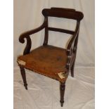 A William IV mahogany carver armchair with rail back and leather upholstered seat on turned legs