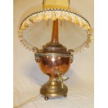 A 19th Century brass mounted copper Samovar with brass tap and oval base,