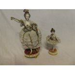 A Naples porcelain figure of a female dancer with encrusted floral dress on circular base (slight