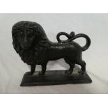 A 19th Century cast iron doorstop in the form of a standing lion,