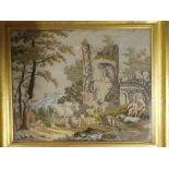 A 19th Century needlework rectangular tapestry depicting ruined landscape with figures and animals
