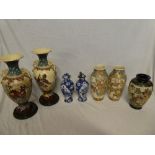 A pair of Japanese Satsuma pottery tapered vases with painted figure decoration,