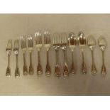 A part set of Victorian silver fiddle and scallop decorated table cutlery including four table