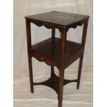 An early 19th Century mahogany square two tier night stand with a single drawer in the frieze on