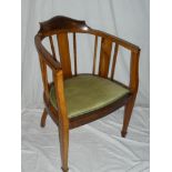 An Edwardian walnut occasional chair with rail back and upholstered seat on square legs