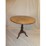 A 19th Century mahogany circular snap-top occasional table on turned column with tripod base