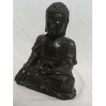 An early Chinese iron figure of a seated buddha,