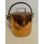 A 19th Century copper cylindrical bucket and cover with iron swing handle, stamped "CB No.