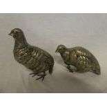 A pair of white metal figures of Quail,
